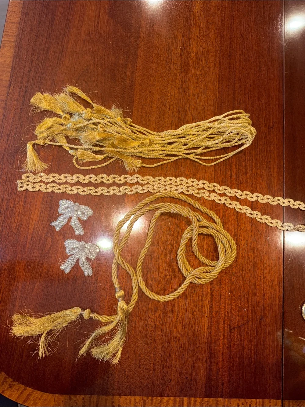 Gold Braided Rope tassel and dozen gold tie backs   Gold Venice trim, silver bow